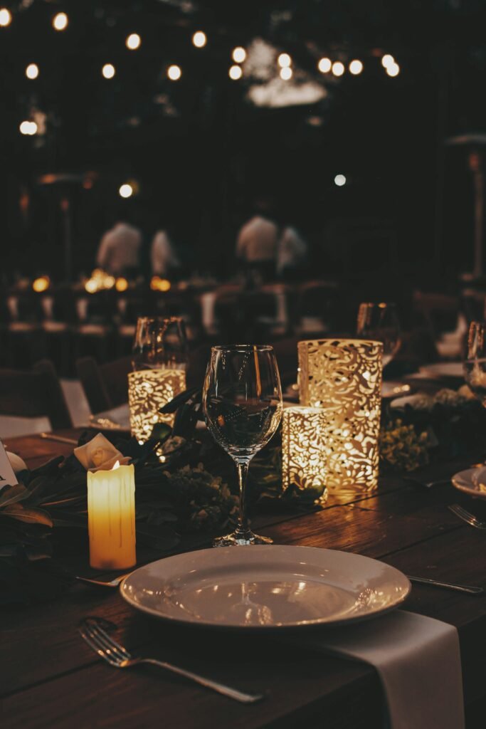 Candlelit event tables with glassware